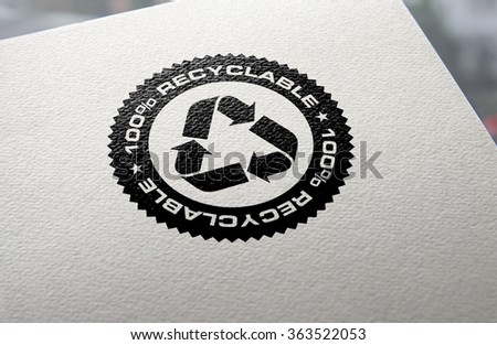 Recycle logo hot stamped on recycled paper background.