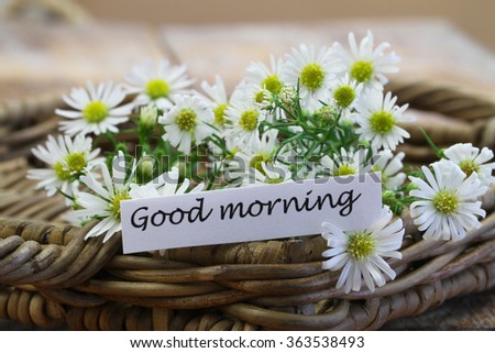 Good morning card with chamomile flowers in wicker basket
