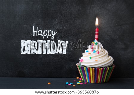 Birthday cupcake in front of a chalkboard Royalty-Free Stock Photo #363560876