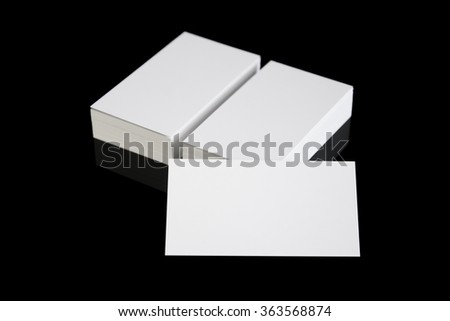 White blank business cards photo mock up isolated on black background