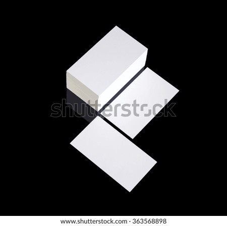White blank business cards photo mock up isolated on black background