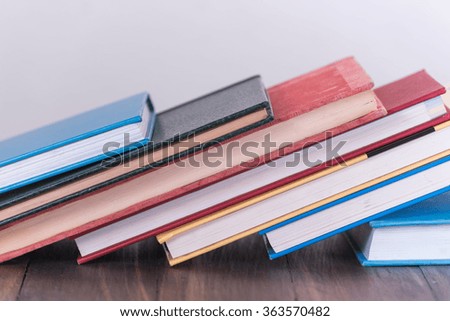 stack of book on wooden table
