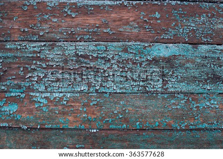 Grunge texture: old wooden planks with peeling paint