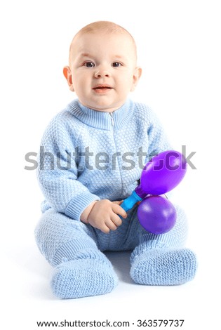 Adorable baby with plastic musical toy isolated on white background