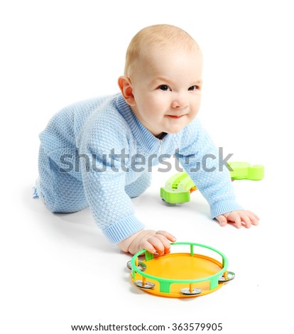 Adorable baby with plastic colourful toys isolated on white background