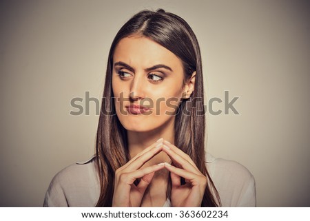 Closeup portrait of sneaky, sly, scheming young woman plotting something isolated on gray background. Negative human emotions, facial expressions, feelings, attitude Royalty-Free Stock Photo #363602234