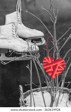red heart on the background of a pair of skates. theme for Valentine's Day