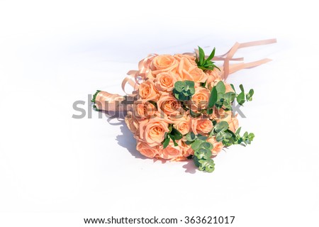 picture of a wedding bouquet , Wedding bouquet of roses lying on white background (light nature)