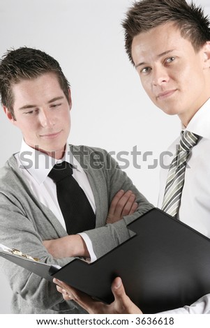two businessman looking at the contract, symbolic picture