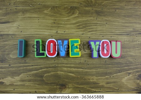 Word "I LOVE YOU" made with block wooden letters