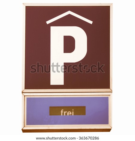  A road sign for a parking area - in German (Deutsch) - isolated over white background vintage