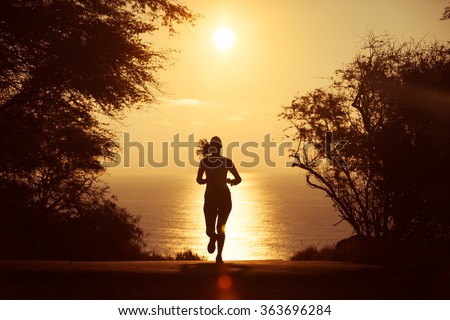 Female going for a early morning run.  Royalty-Free Stock Photo #363696284