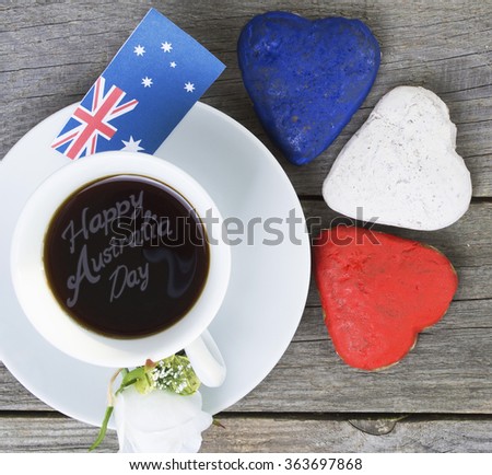 Heart shaped cookies red, white, blue. cup of coffee (tea), Australia flag - decoration on old wooden table. Sunny morning.  Australia  Concept wishes for the holidays, information text. Toned colored