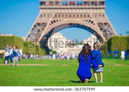 Happy family in Paris background Eiffel on french vacation