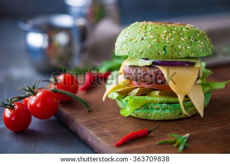 Home made burgers on wooden table