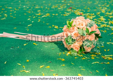 picture of a wedding bouquet , Wedding bouquet of roses lying on green background