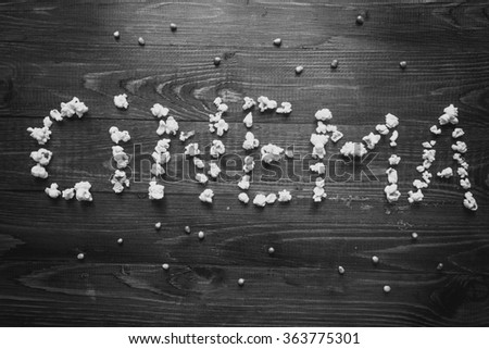 Black and white photo of Cinema spelled with popcorn
