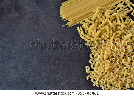 background raw pasta on a dark background