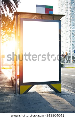 Blank lightbox on the bus stop. Sunlights effects. Vertical