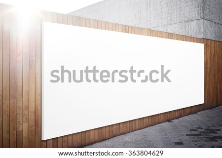 Blank billboard on the wood wall. 