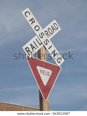 Crossing railroad yield street sign