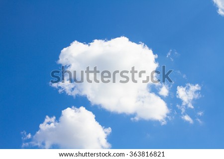 light blue summer sky with little fluffy white clouds, white little cloud in the summer blue sky
