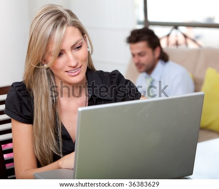 Woman at home working on a laptop computer