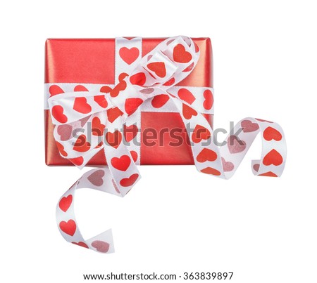 Perfectly packed gift with bow from ribbon hearts for St. Valentine's Day on the white