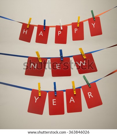 happy new year 2017 word hanging on the Notes paper cards in clothes pegs on rope