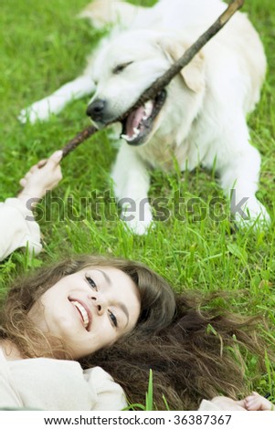 Picture of the girl with the golden retriever walk in the park