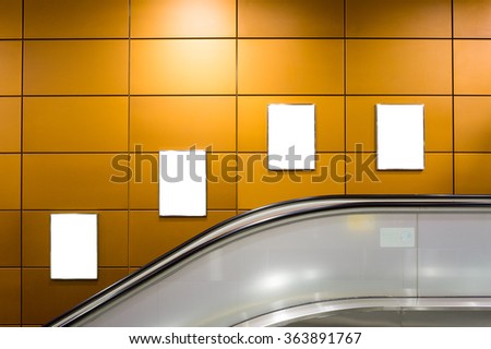 Four big vertical / portrait orientation blank billboard with escalator background