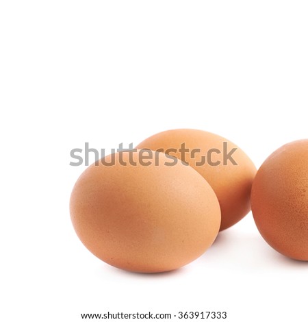 Three brown eggs composition isolated
