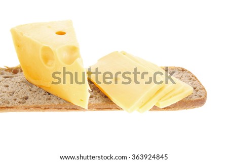 yellow fromage french cheese bar and slice on rye bread isolated over white background
