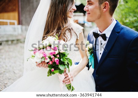 Close up portrait of stylish wedding couple
