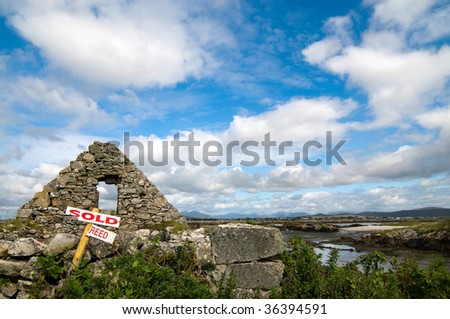 Sales sign at an old ruin on the beach(seashore) of Carna in Connemara Ireland