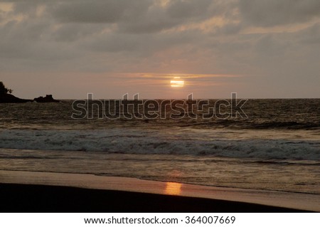 Sunset at Black Beach, near Mompiche, Ecuador Royalty-Free Stock Photo #364007669