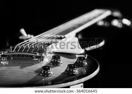 Electric guitar isolated on a black background black and white photo