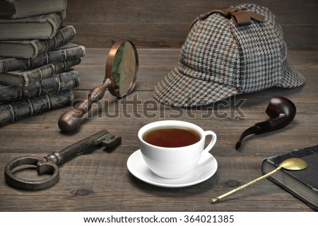 Sherlock Concept. Private Detective Tools On The Wood Table Background. Deerstalker Cap,  Magnifier, Key, Cup, Notebook, Smoking Pipe.Overhead View Royalty-Free Stock Photo #364021385