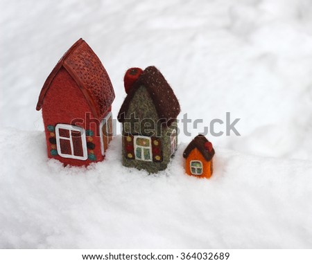toy houses on snow,  winter landscape 
