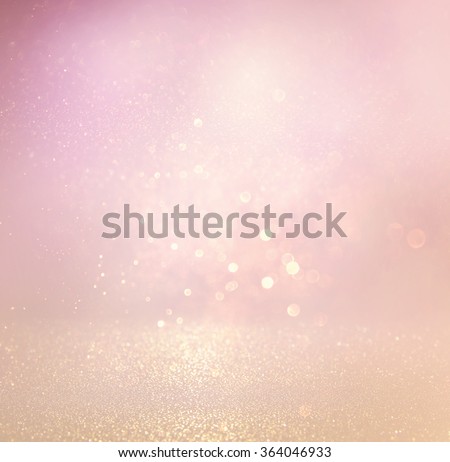 glitter vintage lights background. light silver, purple and pink. defocused.
