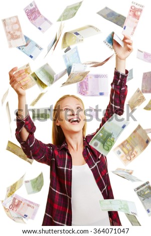 Young lucky woman catching money in rain of Euro bills