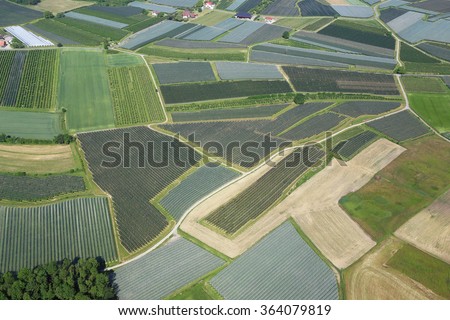fields and gardens covered with protective net. aerial photography. Germany, near Konstanz