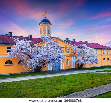 Spring evening scene in Wilhelmshohe Park. Blossom cherry trees in the velcome Germany town Kassel, German, Europe.