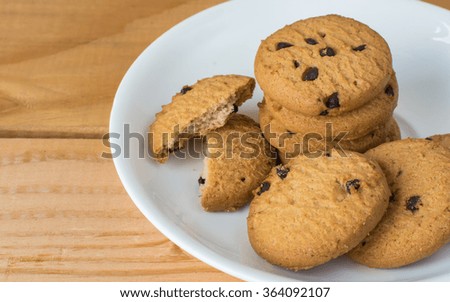 cookie on a white plate with wood background