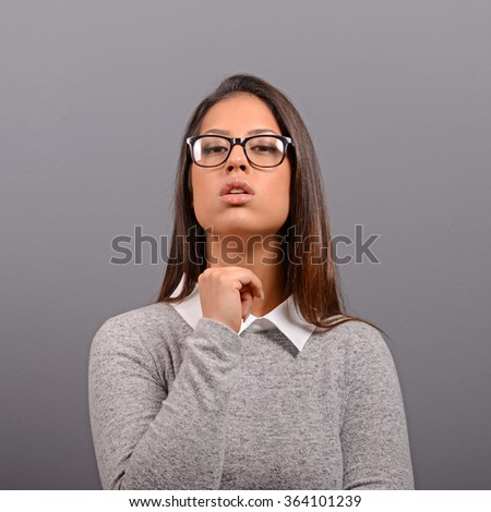 Portrait of a confident business woman against gray background