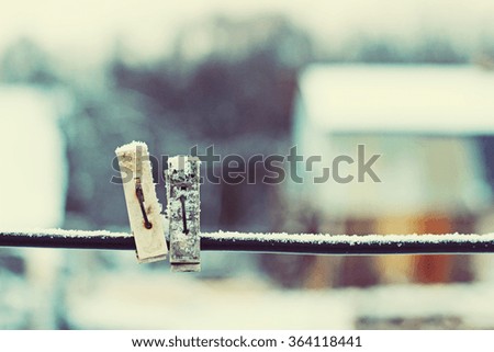 wooden cloth pegs, vintage winter background
