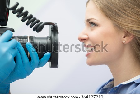 Dentist with camera and patient