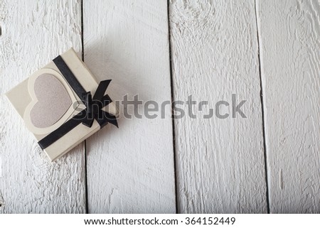 a gift from the heart of paper with love. bright picture on a wooden background