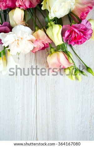 bouquet of beautiful flowers on wooden surface