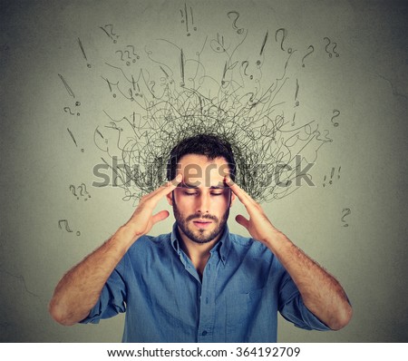 Closeup sad young man with worried stressed face expression and brain melting into lines question marks. Obsessive compulsive, adhd, anxiety disorders Royalty-Free Stock Photo #364192709